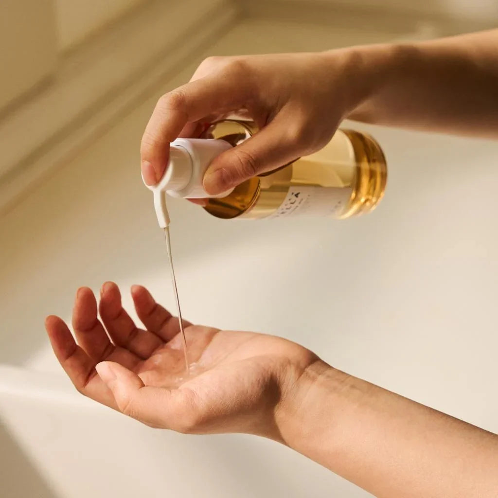 SKIN1004 Madagascar Centella Light Cleansing Oil being dispensed into a hand
