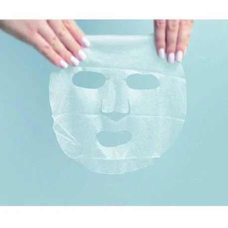 Hands holding a white Eunyul Korean sheet mask against a light blue background.