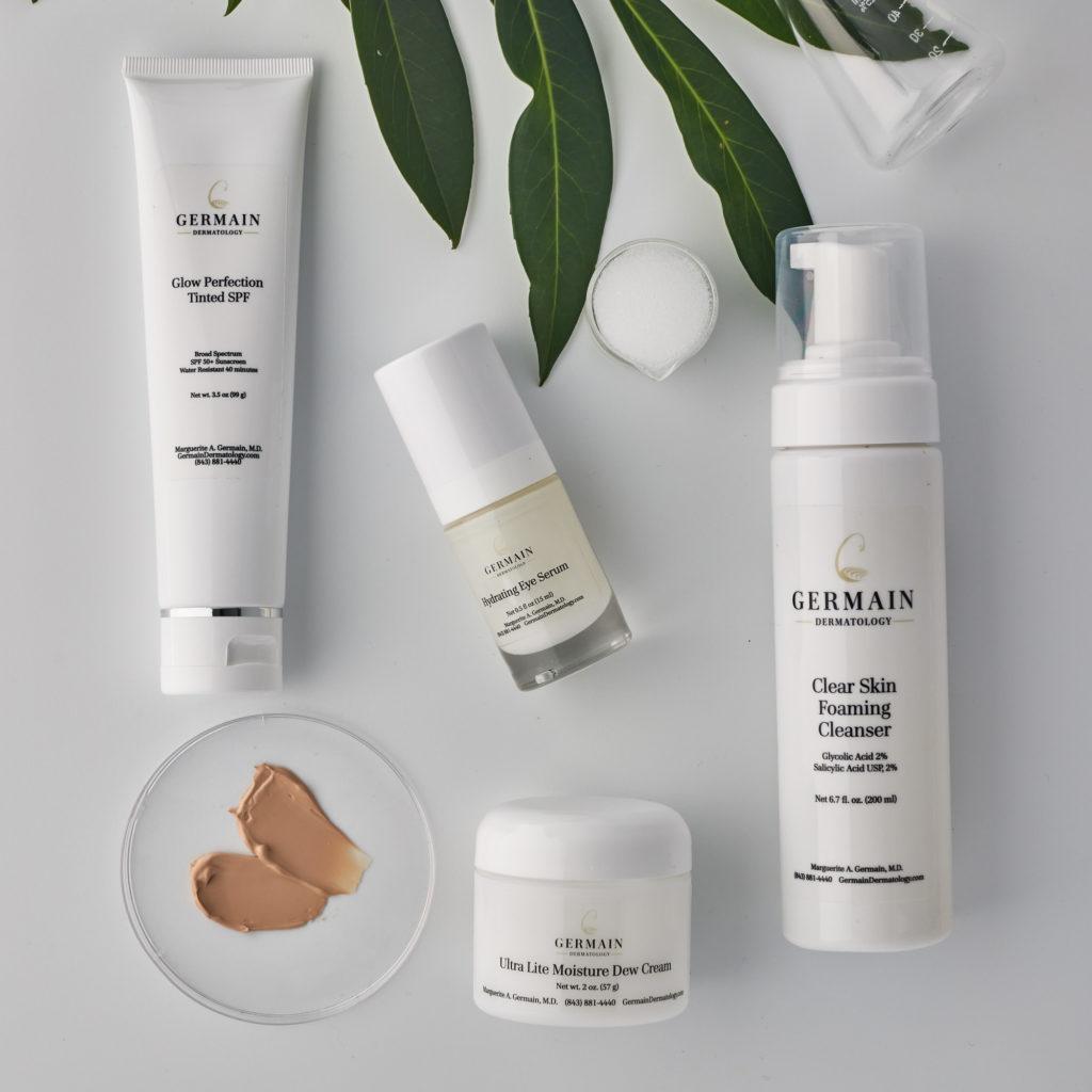 GERMAIN dermatology skincare set including tinted SPF, eye serum, cleanser, and dew cream.